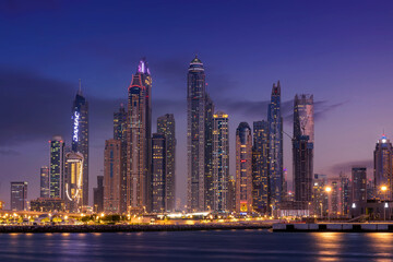 Fototapeta na wymiar Sunset view of Dubai Marina and famous Jumeirah beach skyline Emirates