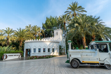 Tourist train and tourist office at the entrance to the palm grove and park of the city of Elche
