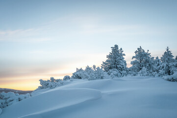 Winter. Landscape of high mountains with snow white peaks and forests. A panoramic view. Wallpaper...