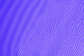 Beautiful purple decorative abstract background with ripples and waves.