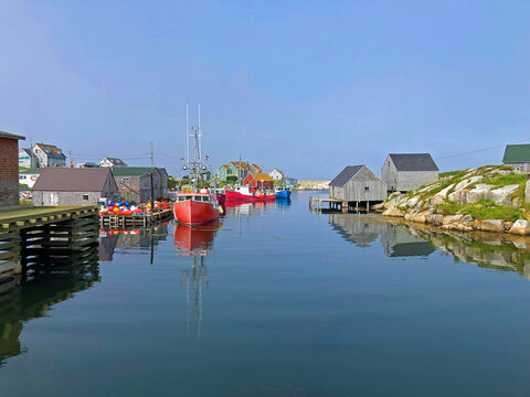 Peggy's Cove fishing boats and harbour on calm day