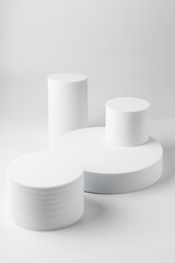 White pedestals cylinders for product photography