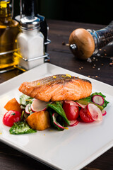 grilled salmon with vegetables on a plate