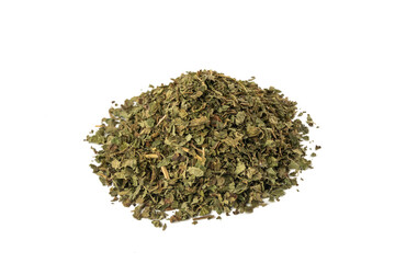 Dried Lemon balm (Melissa officinalis) herb heap isolated on white background.