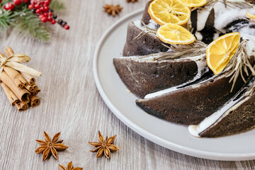 Christmas Pudding, Fruit Cake decorated with icing and cranberries on grey table, copy space. Homemade traditional Christmas festive dessert - Christmas Pudding.