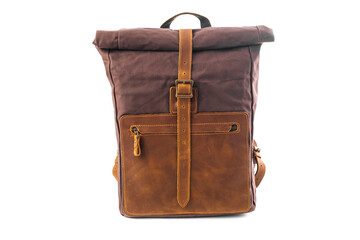 Canvas Backpack isolated on white background. Burgundy with brown bag. Hand made backpack for travelers.