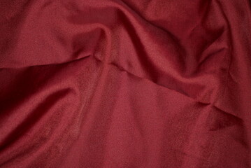 red texture from a piece of crumpled fabric on old clothes