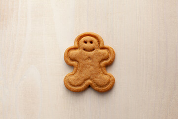 gingerbread cookie on white wooden background