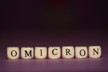 New coronavirus variant OMICRON written on purple dark background