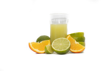 Glass of lime juice and sliced lime fruits, isolated on white background.