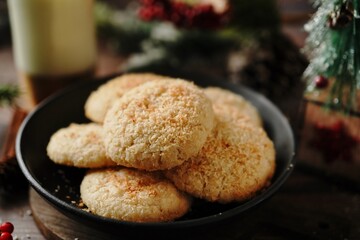 Homemade Coconut cookies or Indian biscuits on festive xmas background, selective focus