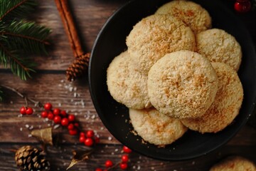 Homemade Coconut cookies or Indian biscuits on festive xmas background, selective focus