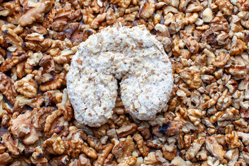 walnut cookie on crushed walnut background