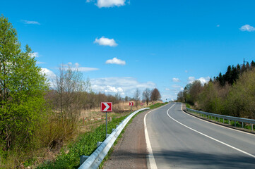 highways in the mountains against the background of the sunny sky and the white clouds