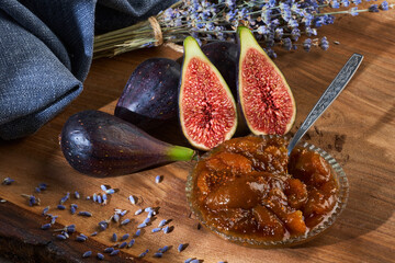 Figs and jam on a wooden board
