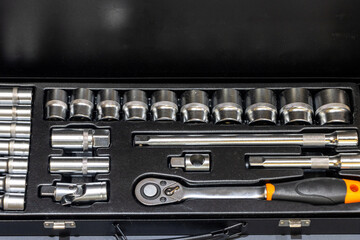 Socket wrench and sockets. Mechanical repairing tool kit box