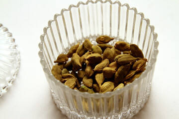 Cardamom or cardamon  is a spice made from the seeds of several plants in the genera Elettaria and Amomum in the family Zingiberaceae