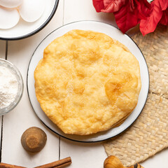 Christmas fritters with piloncillo and cinnamon on a white background. Mexican food