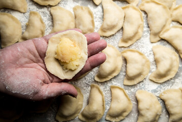hands sculpt dumplings