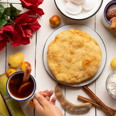 Christmas fritters with piloncillo and cinnamon on a white background. Mexican food
