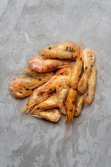 Dried shrimp on a gray background