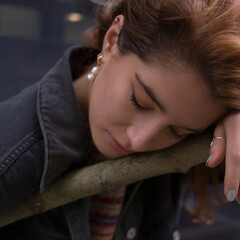 Portrait of a young woman with dark red hair
