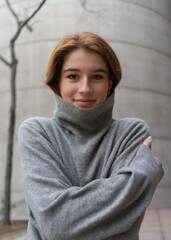 Portrait of a young woman with dark red hair