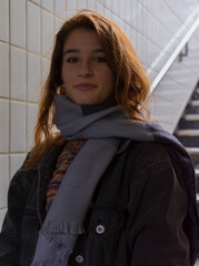 Portrait of a young woman with dark red hair