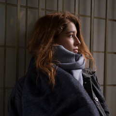 Portrait of a young woman with dark red hair