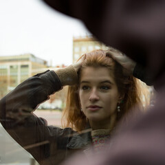 Portrait of a young woman with dark red hair