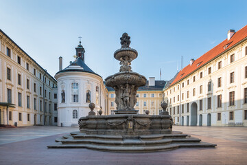 Fototapeta na wymiar View of beautiful fountain in a inner square at Prague's Castle Complex - Prague, Czech Republic