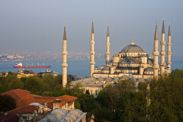 Fototapeta na wymiar Sultanahmet Camii (Blue Mosque) and freighter in Sea of Marmara, Istanbul, Turkey