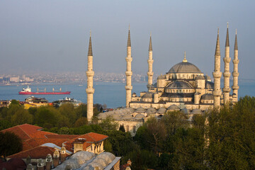 Naklejka premium Sultanahmet Camii (Blue Mosque) and freighter in Sea of Marmara, Istanbul, Turkey