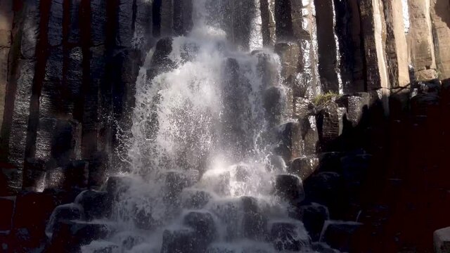 Waterfall from the basalt prisms geological formation 2, San Miguel Regla, Mexico