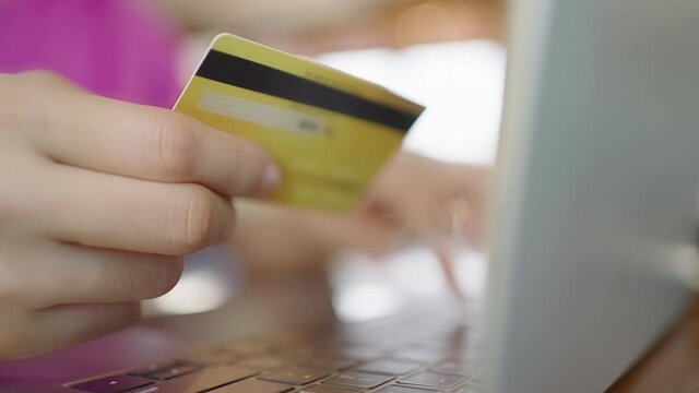 Woman holding credit card and smartphone for online shopping via mobile application. online transaction concept Use of technology in everyday life
