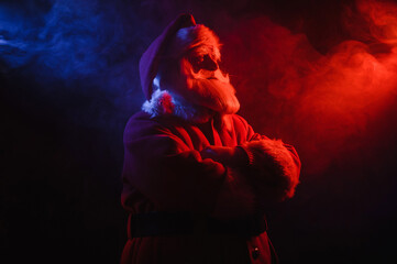 Santa claus in blue red smoke. Party for Christmas.