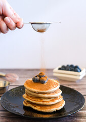 pancakes on a black plate