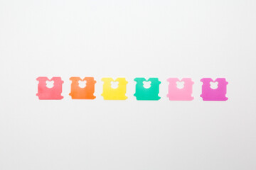Colorful Plastic for sealing bread bags on white background