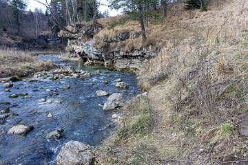 traveling along the bed of a mountain river, an autumn day, nature is preparing for winter hibernation.