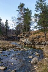 traveling along the bed of a mountain river, an autumn day, nature is preparing for winter hibernation.