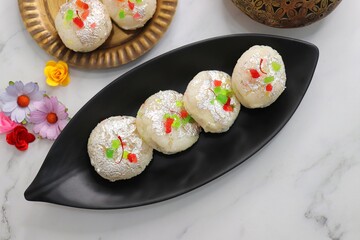 Rasmalai or Malai Sandwich, Roshmolai, Rasamalei is very popular Indian dessert. A sweet malai stuffing inside Rasgulla. It's a sweet delicacy made with Indian cottage cheese or chenna. Copy space.