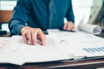 Businessman working on office desk and analyzing new project of accounting finance. Investment, Financial advisor, budget, plan and accounting concept.