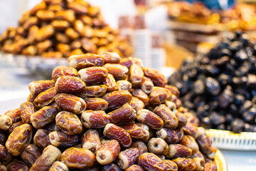 Dried fruits: a display of dates in a Spice souk, Dubai, United Arab Emirates.