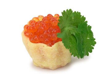 A tartlet filled to the brim with red caviar and a parsley leaf