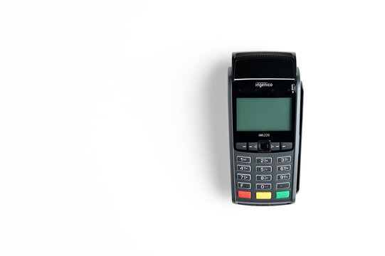 Moscow, Russia - July 8, 2020, wireless credit card payment terminal Ingenico on a white background.