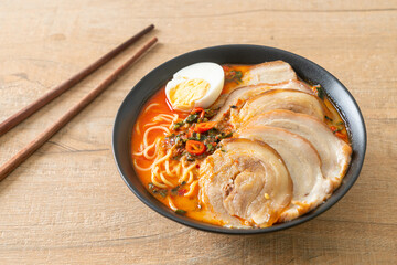 Ramen Noodles Spicy Tomyum Soup with Roast Pork