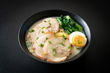 Ramen noodles in pork bone soup with roast pork and egg