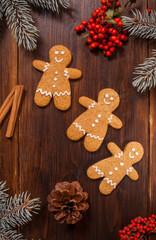 Gingerbread man cookies are on the wooden table. - 474615794