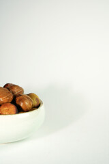 roasted chestnuts on a white background, winter