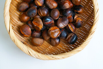 roasted chestnuts on a white background, winter